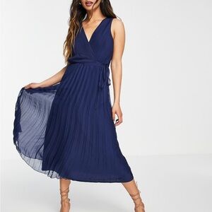 ASOS DESIGN wrap bodice midi dress with tie waist and pleat skirt in navy.